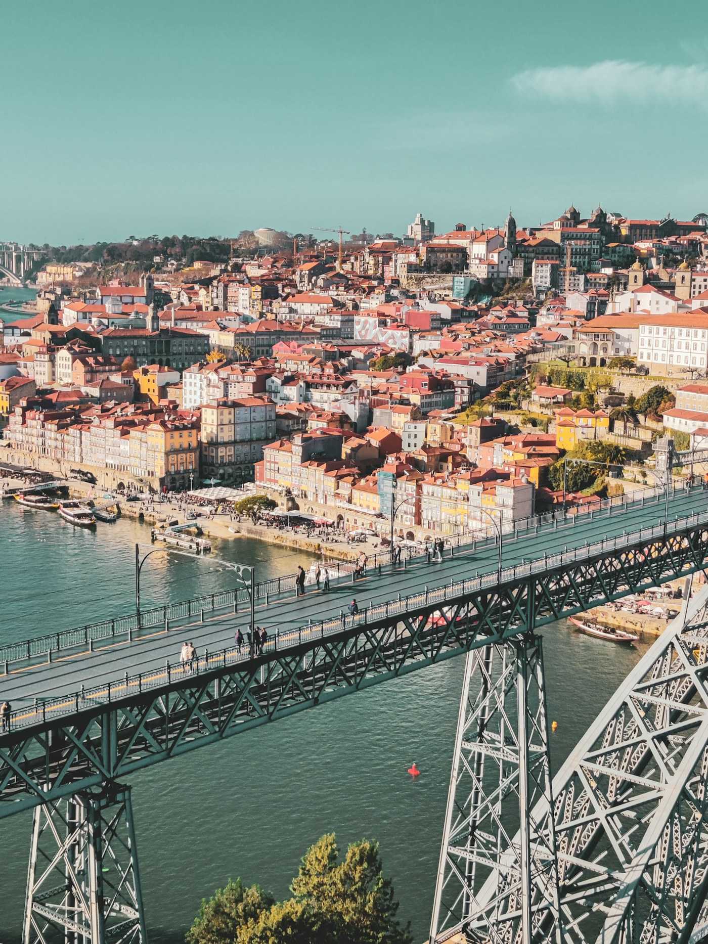 The Dom Luís I bridge spanning the Douro river, with Porto’s riverside houses beyond